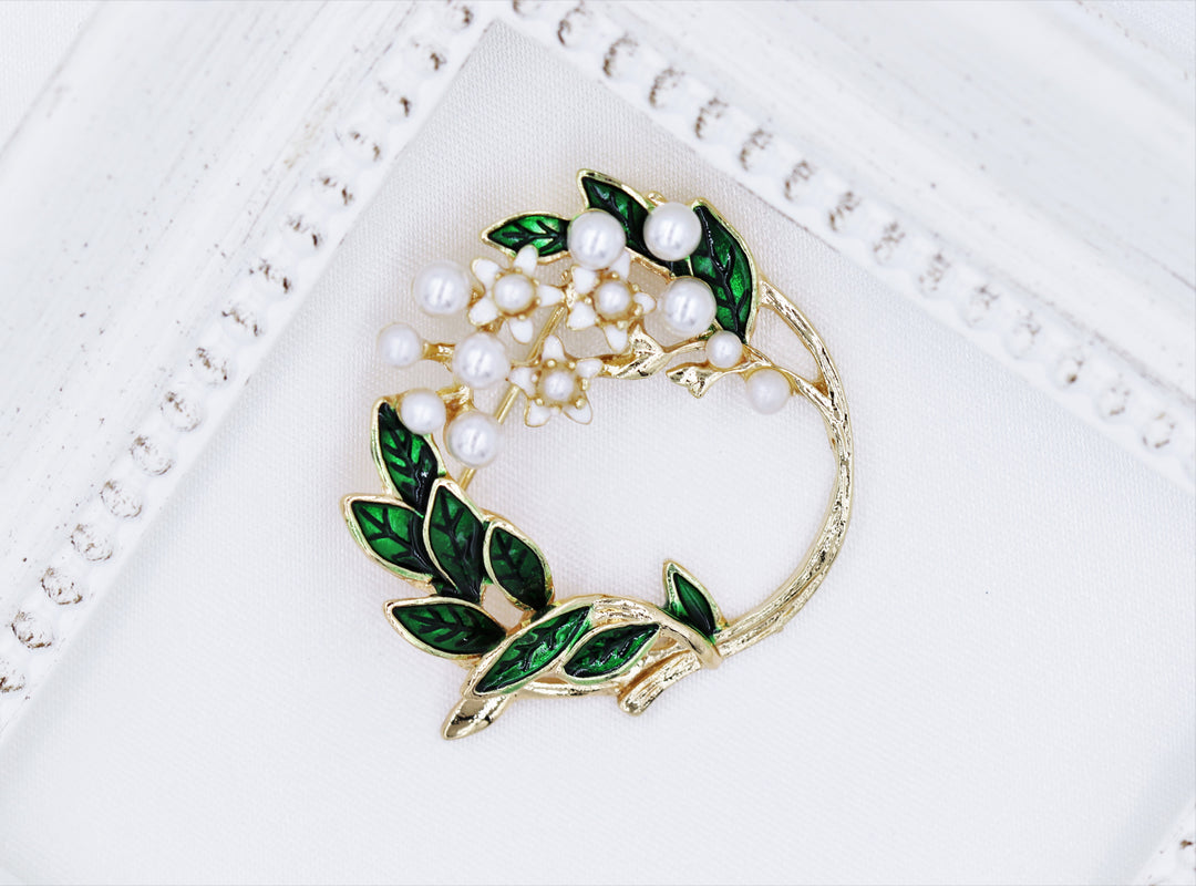 white flower brooch