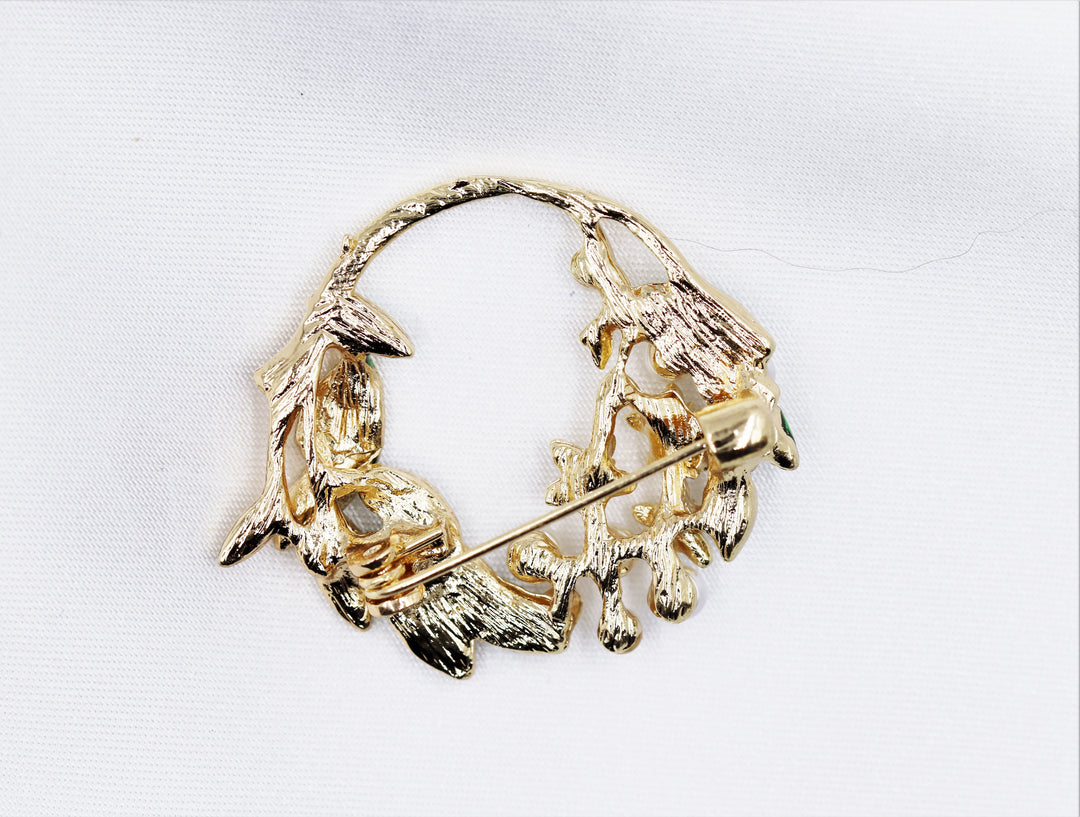 golden brooch