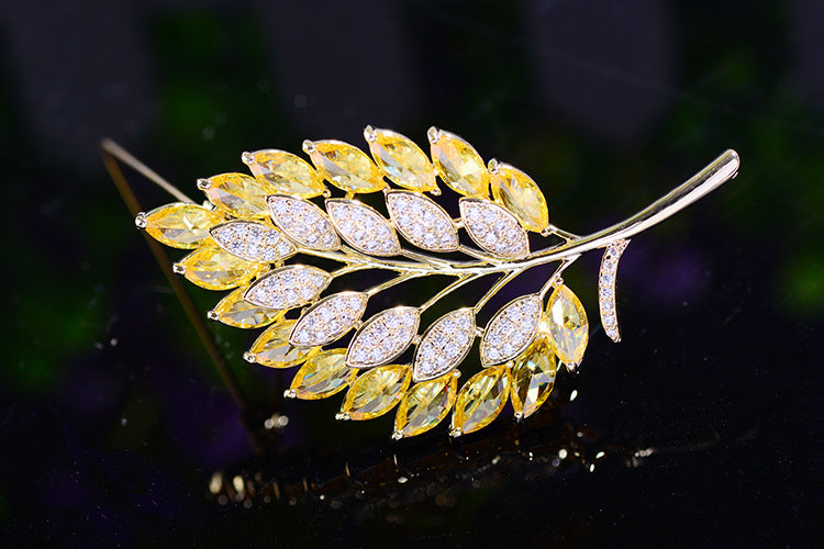 elegant crystal leaf brooch