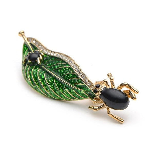 green enamel golden brooch